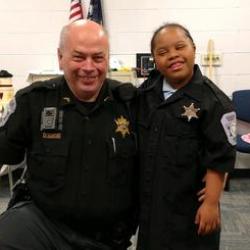Officer with Kid Dressed as Officer