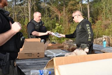Officer handing out gear