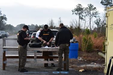 Officers unloading weapons