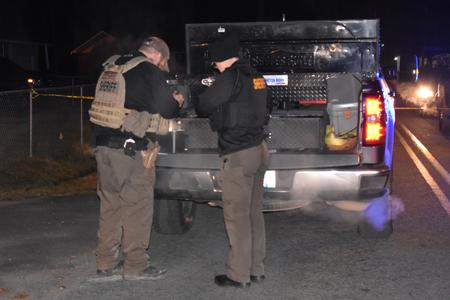 Officers in back of evidence vehicle